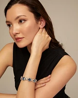 Link chain bracelet with a blue crystal