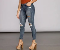 Josie Mid Rise Destructed Skinny Jeans