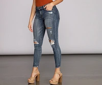 Josie Mid Rise Destructed Skinny Jeans