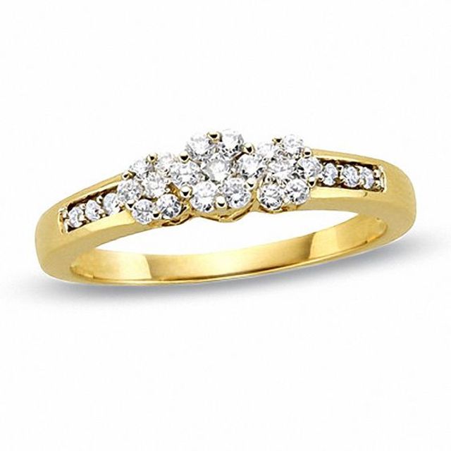 1/5 CT. T.w. Diamond Flower Three Stone Ring in 10K Gold