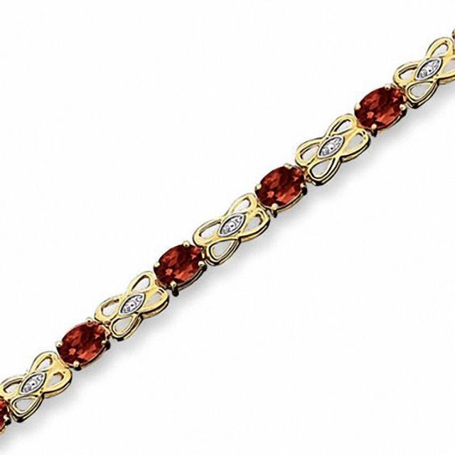 Oval Garnet Fashion Bracelet in 10K Gold with Diamond Accents