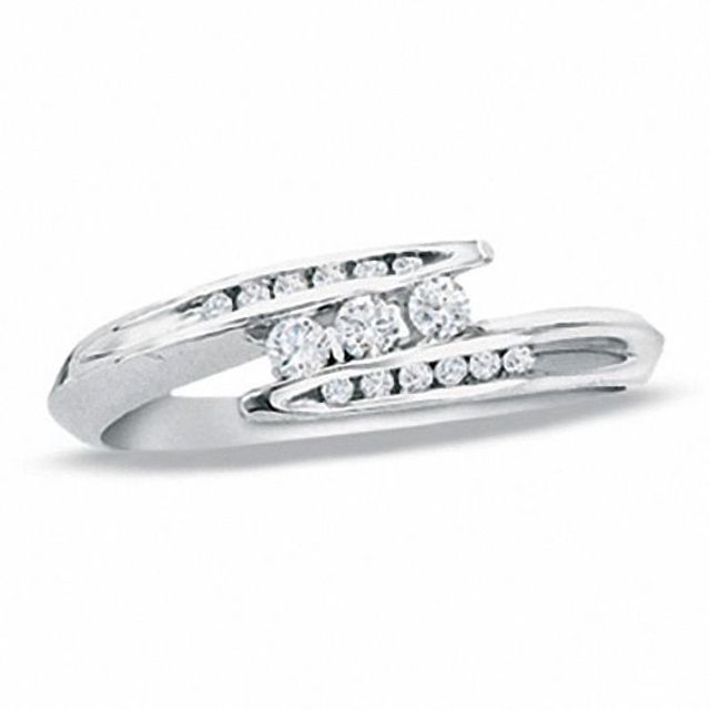 1/5 CT. T.w. Diamond Three Stone Bypass Ring in 10K White Gold