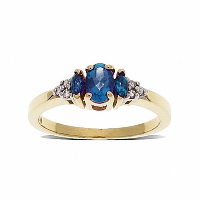 Blue Topaz Three Stone Ring in 10K Gold with Diamond Accents