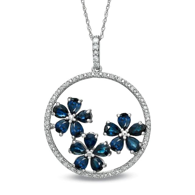 Blue Sapphire and 1/7 CT. T.w. Diamond Circle Flower Pendant in 10K White Gold