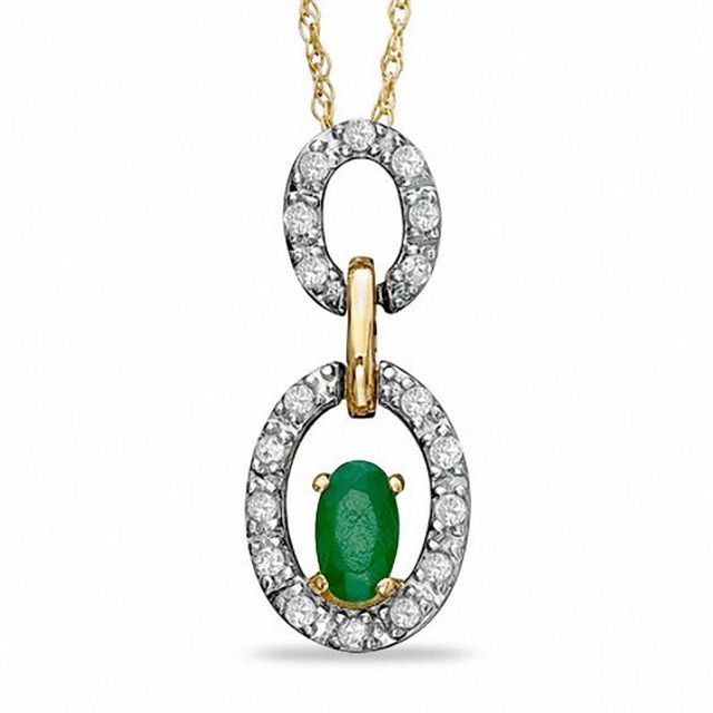 Oval Emerald and 1/8 CT. T.w. Diamond Double Circle Frame Pendant in 10K Gold