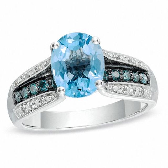 Oval Swiss Blue Topaz and 1/4 CT. T.w. Enhanced Blue and White Diamond Ring in 10K White Gold