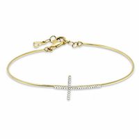1/6 CT. T.w. Diamond Sideways Cross Bangle in 10K Gold - 7.5"