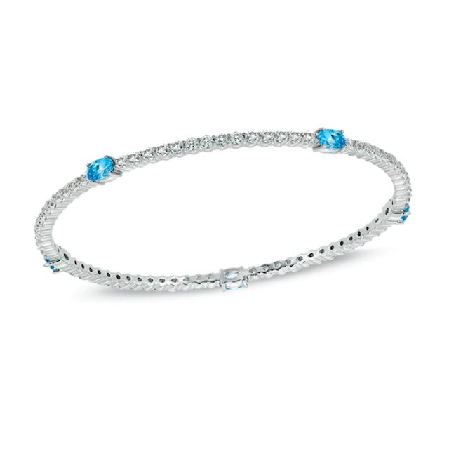 Oval Swiss Blue Topaz and Lab-Created White Sapphire Bangle in Sterling Silver - 8.0"