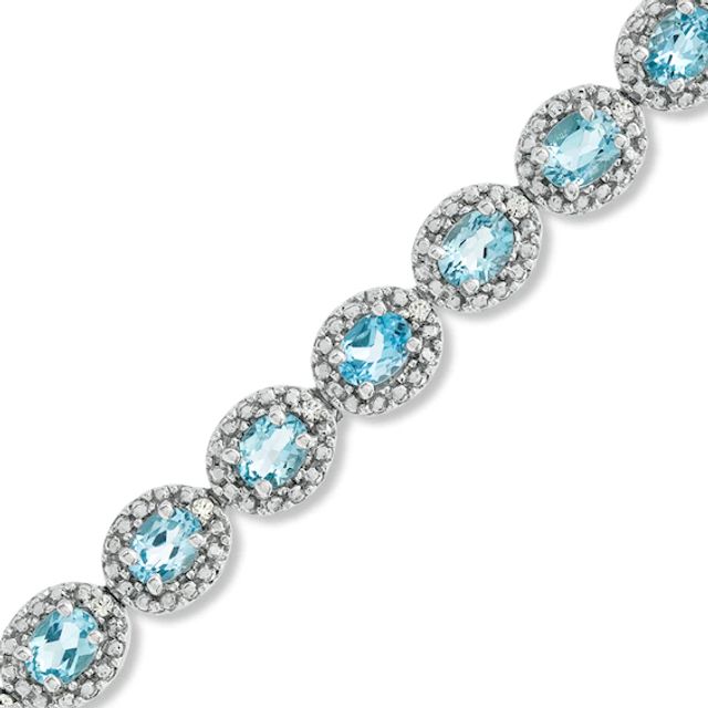 Oval Blue Topaz and 1/20 CT. T.w. Diamond Bracelet in Sterling Silver - 7.5"