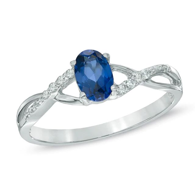 Oval Lab-Created Blue Sapphire and Diamond Accent Twist Engagement Ring in 10K White Gold