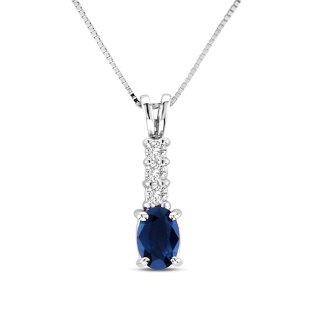 Oval Blue Sapphire and 1/10 CT. T.w. Diamond Pendant in 14K White Gold