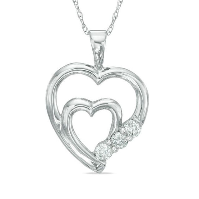 1/10 CT. T.w. Diamond Three Stone Double Heart Pendant in 10K White Gold