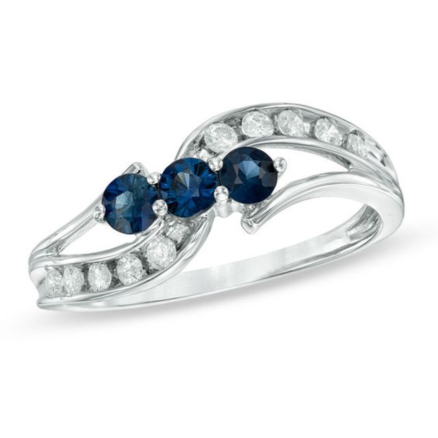 Blue Sapphire and 1/5 CT. T.w. Diamond Three Stone Bypass Ring in 10K White Gold