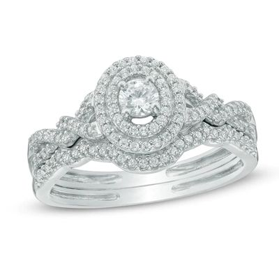 1/2 CT. T.w. Diamond Oval Frame Loose Braid Bridal Set In 10K White Gold
