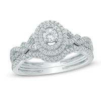 1/2 CT. T.w. Diamond Oval Frame Loose Braid Bridal Set In 10K White Gold