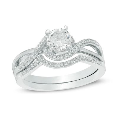 5.5mm Lab-Created White Sapphire and 1/10 CT. T.w. Diamond Swirl Frame Bridal Set in Sterling Silver
