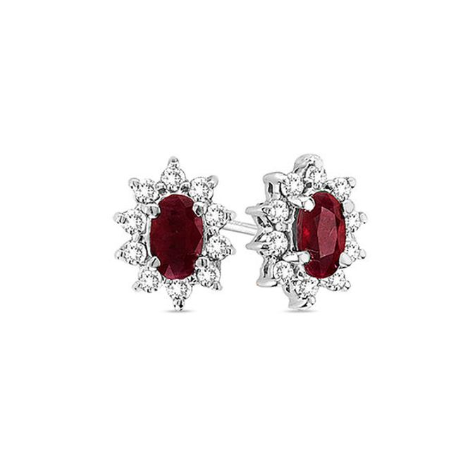 Oval Ruby and 1/3 CT. T.w. Diamond Sunburst Frame Stud Earrings in 14K White Gold