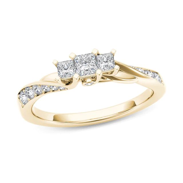 1/2 CT. T.w. Princess-Cut Diamond Three Stone Twist Shank Ring in 14K Gold