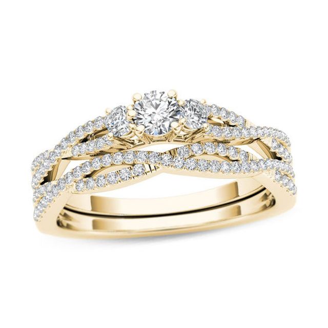 1/2 CT. T.w. Diamond Three Stone Twist Bridal Set in 14K Gold