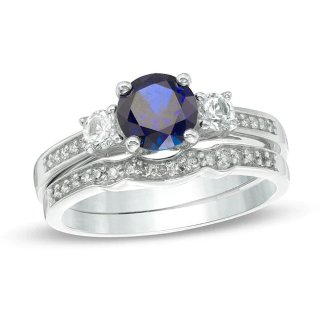 6.0mm Lab-Created Blue and White Sapphire with 1/8 CT. T.w. Diamond Three Stone Bridal Set 10K Gold