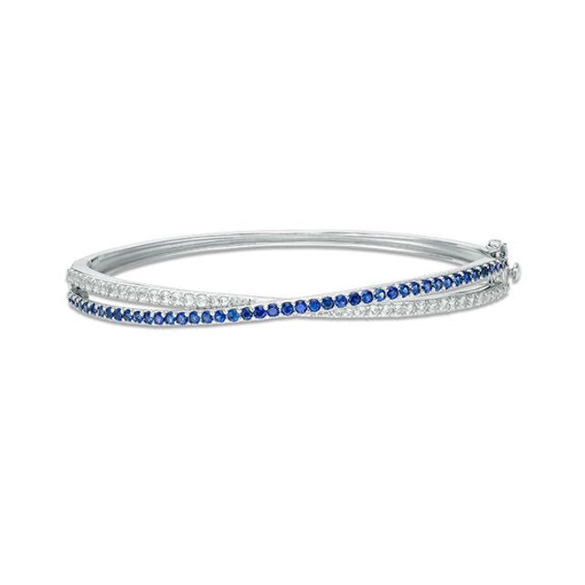 Lab-Created Blue and White Sapphire Crossover Ribbon Bangle in Sterling Silver