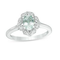 Oval Aquamarine and 1/10 CT. T.w. Diamond Flower Frame Ring in 10K White Gold