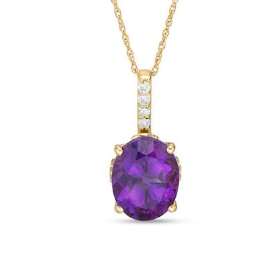 Oval Amethyst and 1/10 CT. T.w. Diamond Drop Pendant in 10K Gold