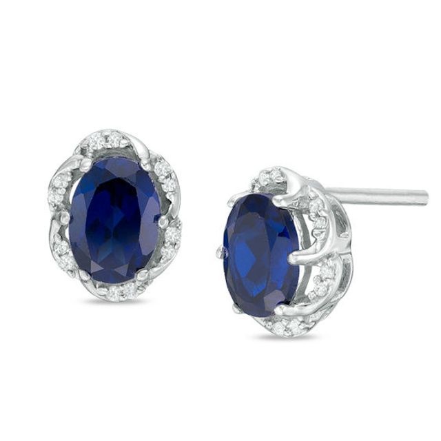 Oval Lab-Created Blue Sapphire and 1/10 CT. T.w. Diamond Frame Stud Earrings in Sterling Silver