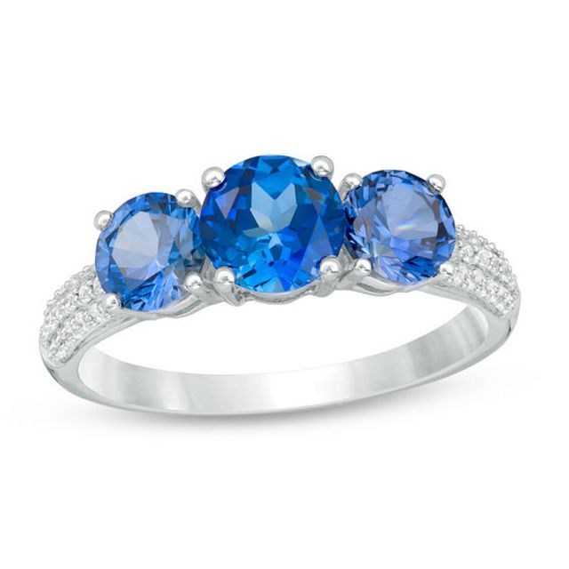 Lab-Created Blue Sapphire and 1/8 CT. T.w. Diamond Three Stone Ring in 10K White Gold