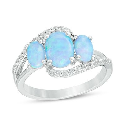 Oval Lab-Created Blue Opal and White Sapphire Three Stone Bypass Ring in Sterling Silver