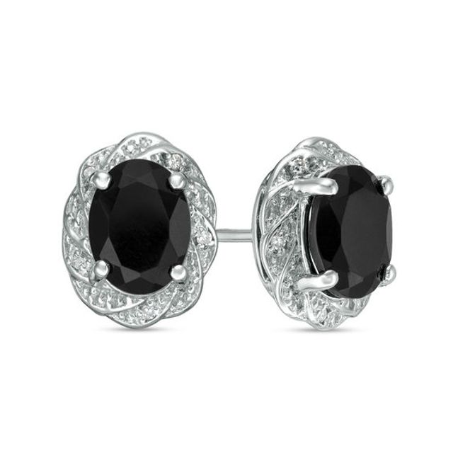 Oval Onyx and 1/20 CT. T.w. Diamond Pinwheel Frame Stud Earrings in Sterling Silver