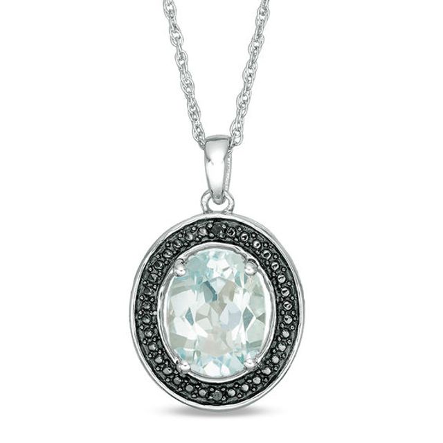 Oval Blue Topaz and Black Diamond Accent Frame Pendant in Sterling Silver