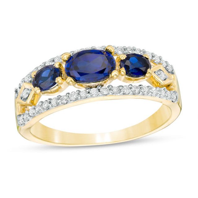 Sideways Oval Lab-Created Blue Sapphire and 1/4 CT. T.w. Diamond Three Stone Ring in 10K Gold