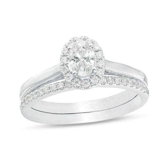 3/4 CT. T.w. Oval Diamond Frame Bridal Set in 14K White Gold