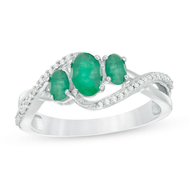 Oval Emerald and 1/10 CT. T.w. Diamond Three Stone Crossover Bypass Ring in 10K White Gold