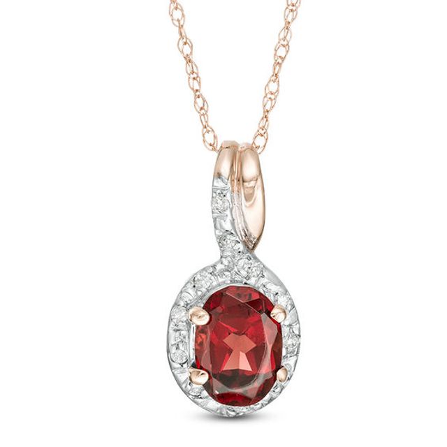 Oval Garnet and 1/20 CT. T.w. Diamond Frame Bypass Pendant in 10K Rose Gold