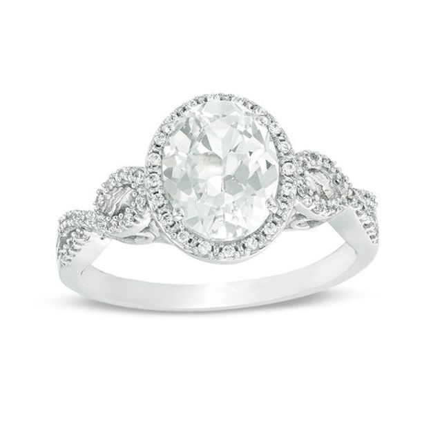 Oval Lab-Created White Sapphire and 1/6 CT. T.w. Diamond Frame Infinity Shank Engagement Ring in Sterling Silver