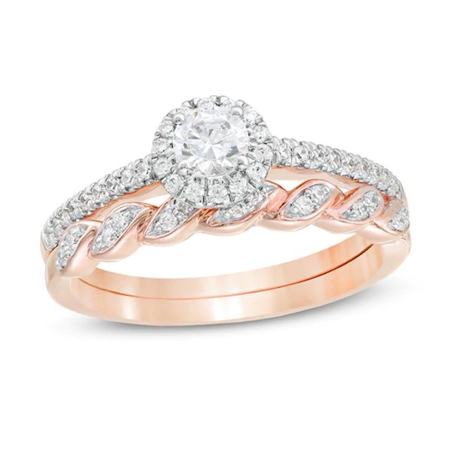 1/2 CT. T.w. Diamond Frame Twist Shank Bridal Set in 10K Rose Gold