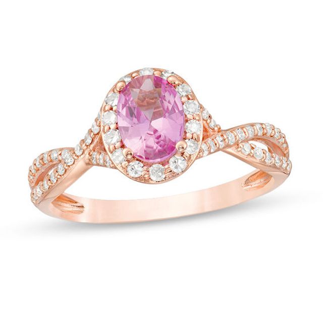 Oval Pink Sapphire and 1/3 CT. T.w. Diamond Frame Crossover Shank Ring in 14K Rose Gold