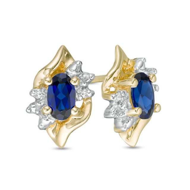 Oval Lab-Created Blue Sapphire and Diamond Accent Flame Burst Stud Earrings in 10K Gold