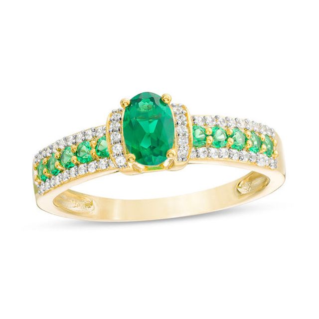 Oval Emerald and 1/10 CT. T.w. Diamond Collar Ring in 10K Gold