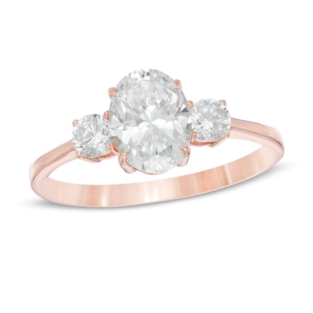 1-1/4 CT. T.w. Oval and Round Diamond Three Stone Engagement Ring in 14K Rose Gold