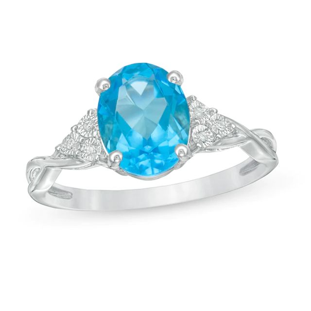 Oval Blue Topaz and Diamond Accent Tri-Sides Twist Shank Ring in Sterling Silver