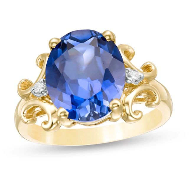 Oval Lab-Created Blue Sapphire and 1/20 CT. T.w. Diamond Scroll Frame Ring in 10K Gold