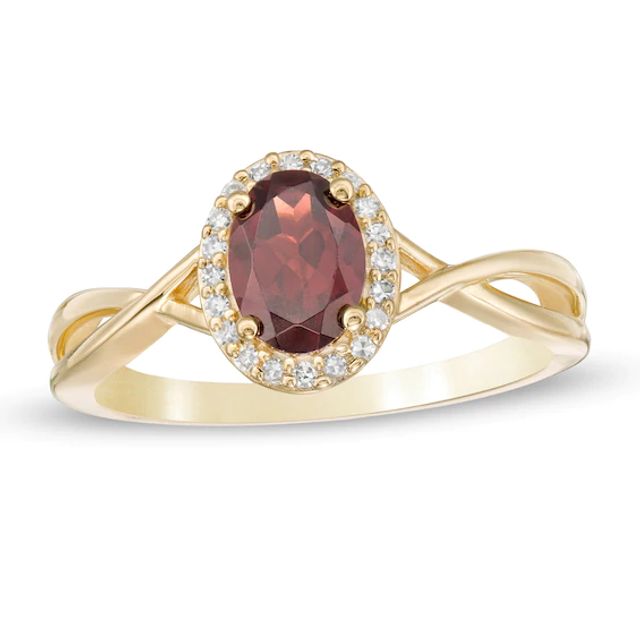 Oval Garnet and 1/15 CT. T.w. Diamond Frame Twist Shank Ring in 10K Gold