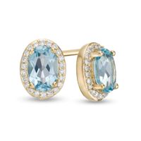 Oval Blue Topaz and 1/10 CT. T.w. Diamond Frame Stud Earrings in 10K Gold