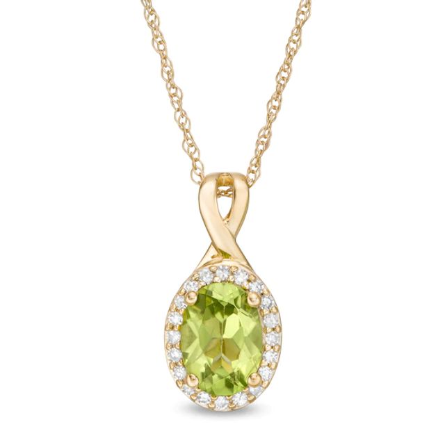 Oval Peridot and 1/15 CT. T.w. Diamond Frame Pendant in 10K Gold