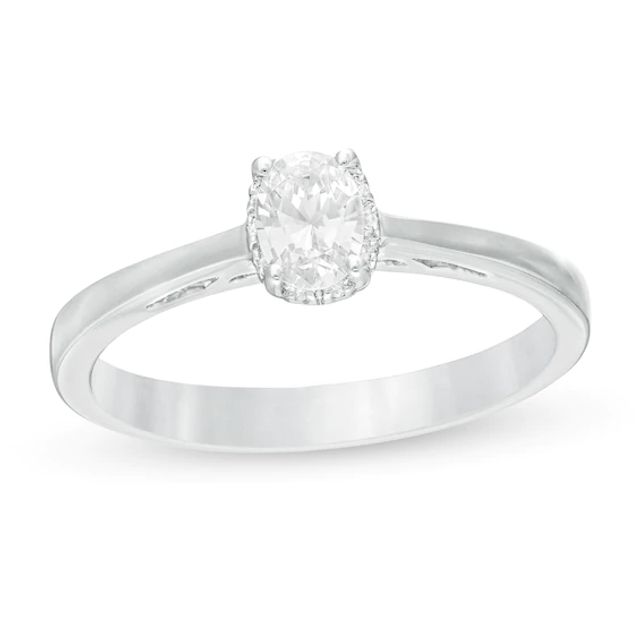 Celebration Ideal 1/3 CT. T.w. Oval Certified Diamond Frame Engagement Ring in 14K White Gold (I/I1)