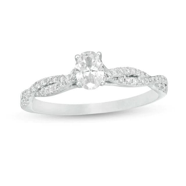 1/2 CT. T.w. Oval Diamond Twist Engagement Ring in 14K White Gold