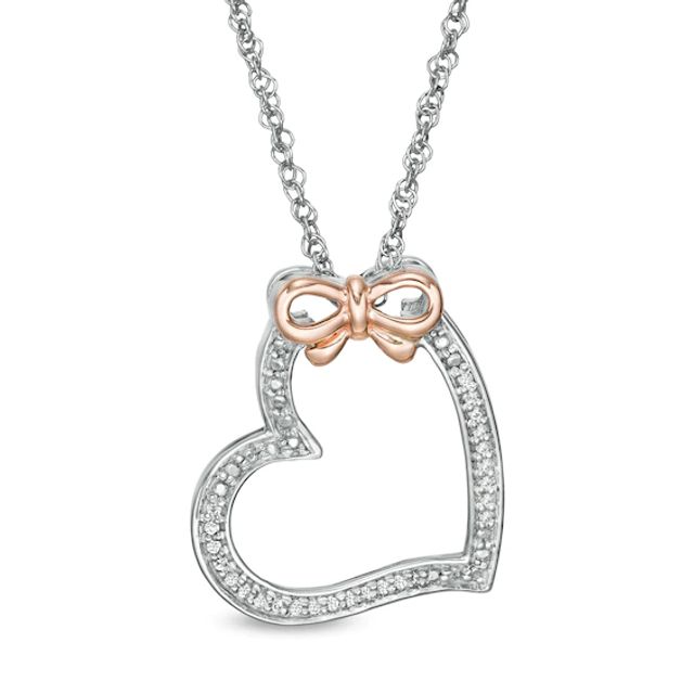 1/20 CT. T.w. Diamond Tilted Heart with Bow Pendant in Sterling Silver and 10K Rose Gold